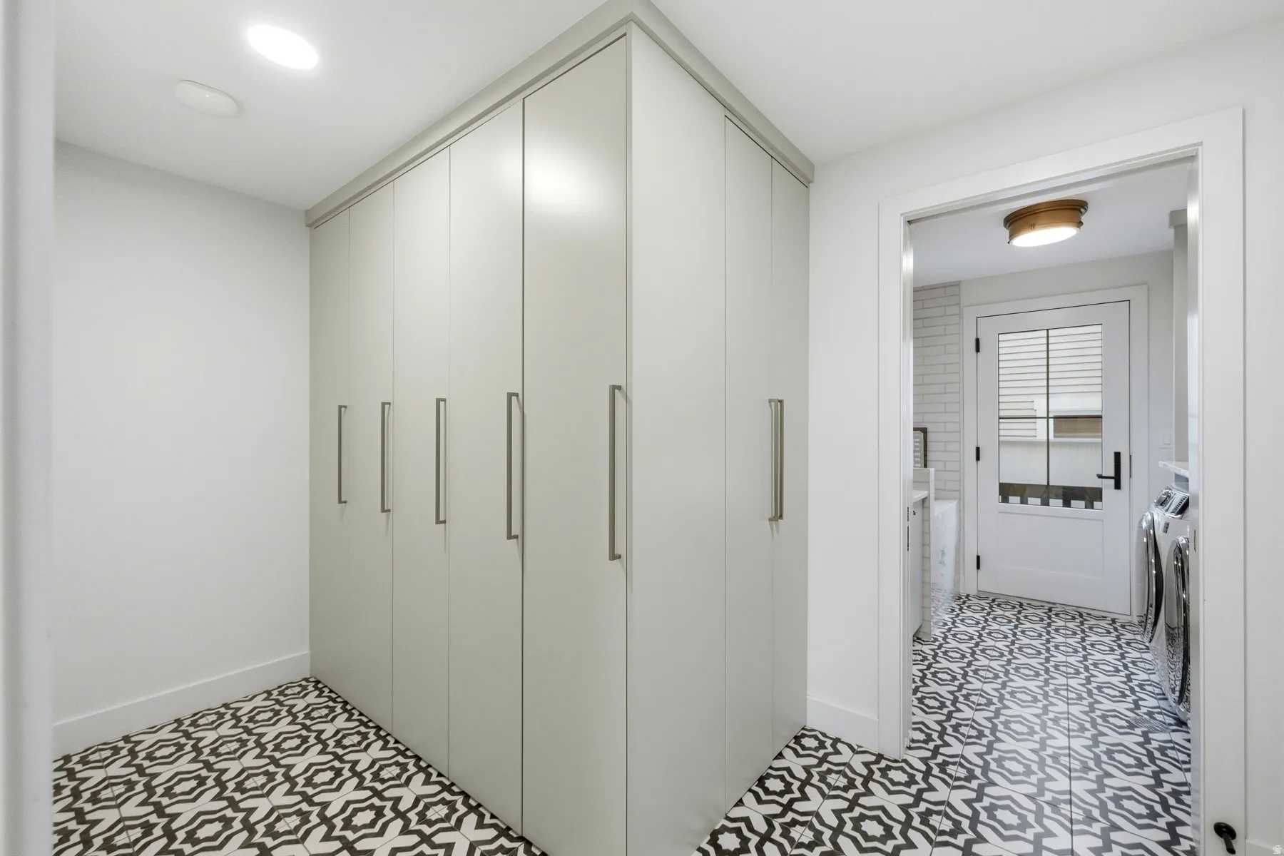 Closet with washer and clothes dryer
