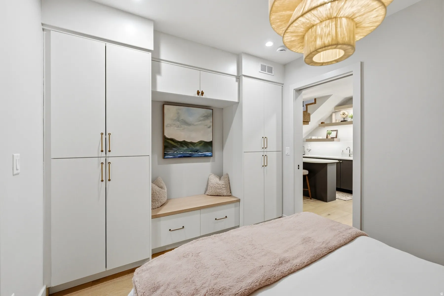 Bedroom featuring light wood finished floors, recessed lighting, and a closet