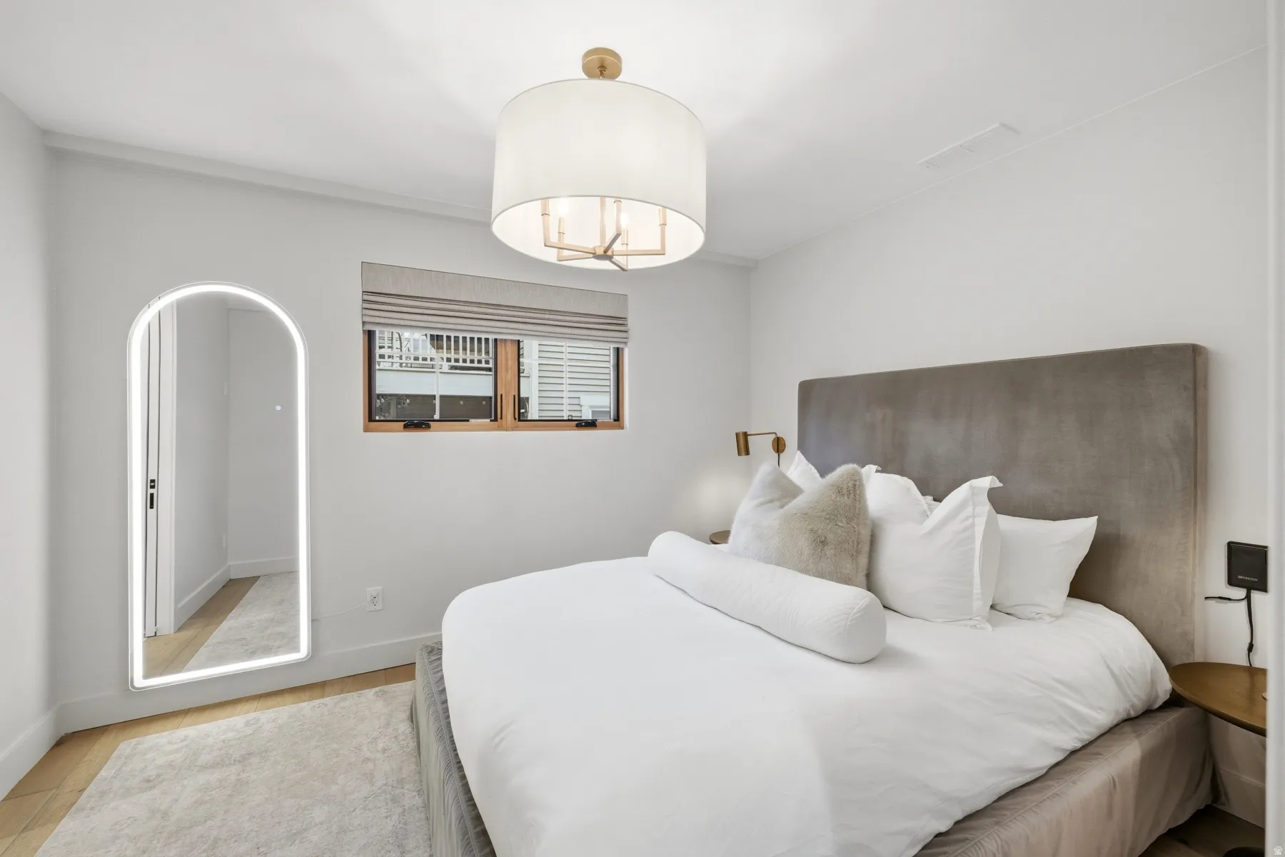 Bedroom featuring light wood finished floors and baseboards