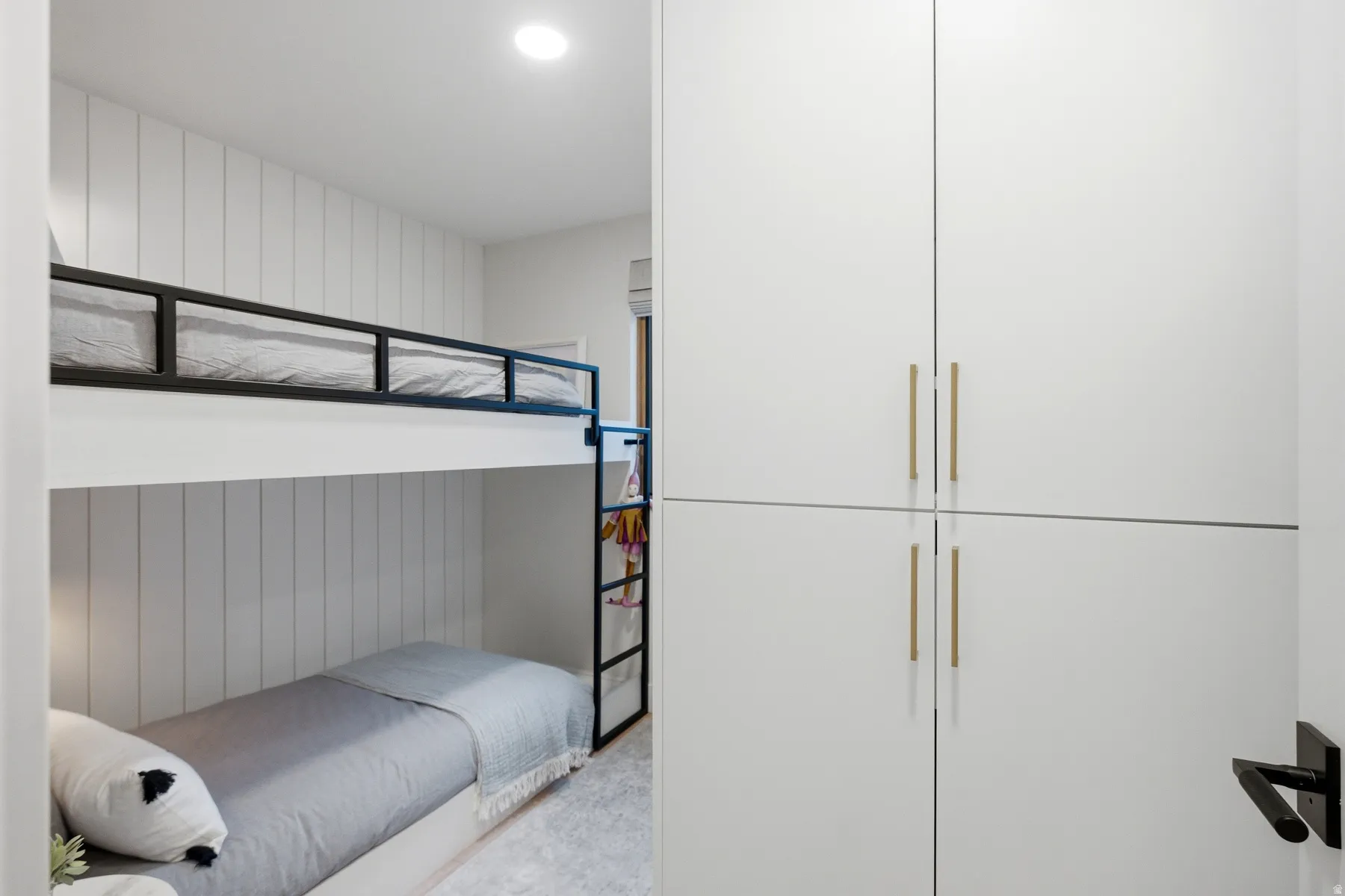 Bedroom with wood walls