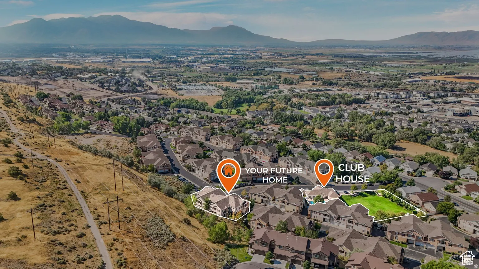 View of property location featuring a mountainous background and nearby suburban area