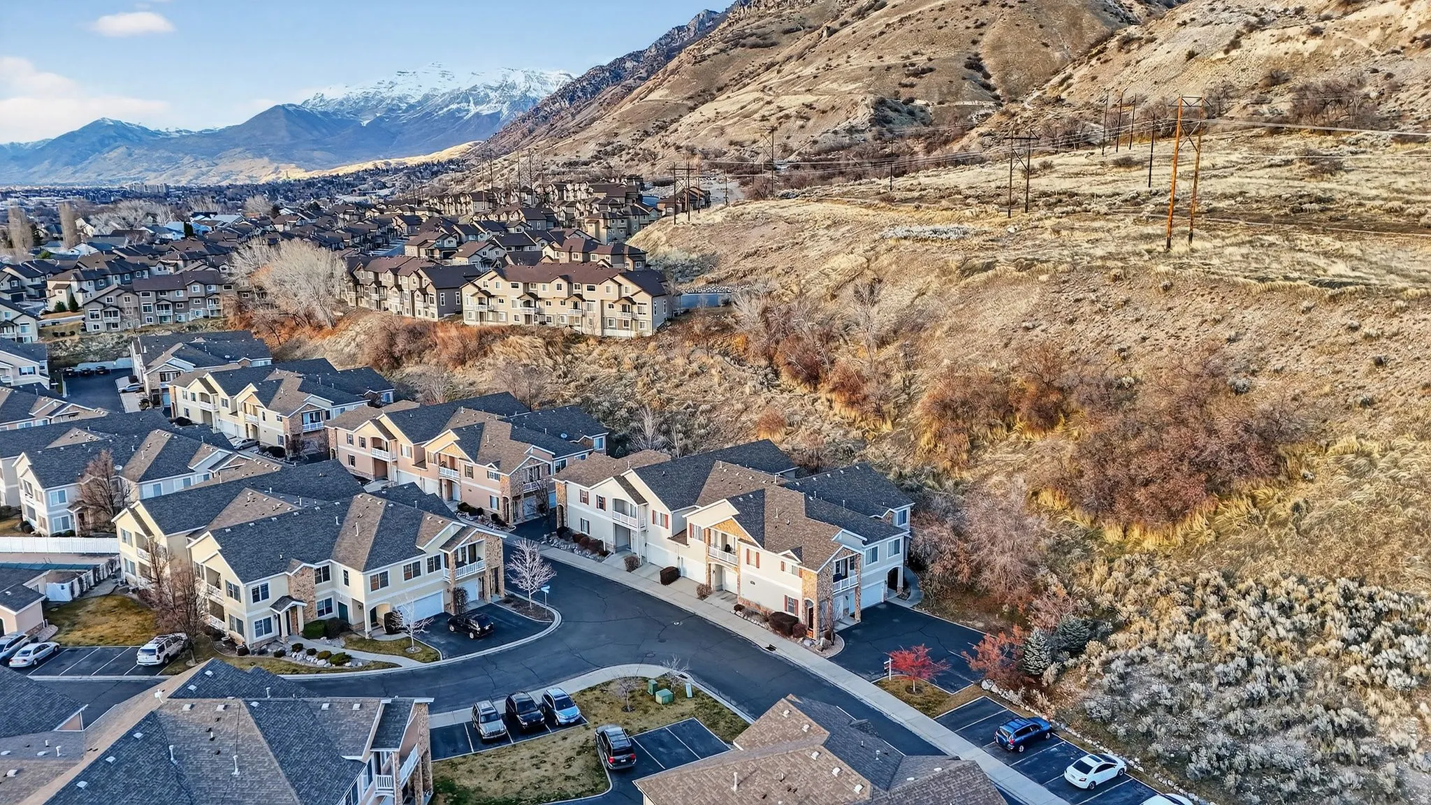 Aerial overview of property's location featuring a mountainous background