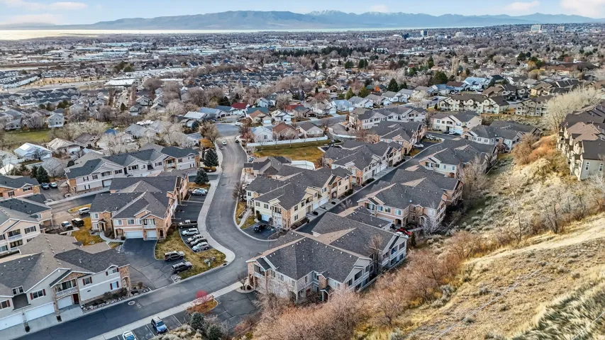 View of property location featuring a mountainous background and nearby suburban area