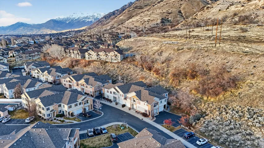 Aerial overview of property's location featuring a mountainous background