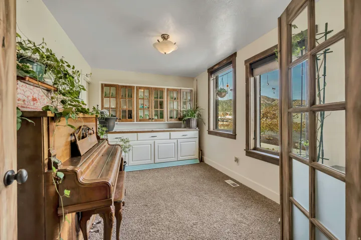 Office featuring baseboards and light carpet