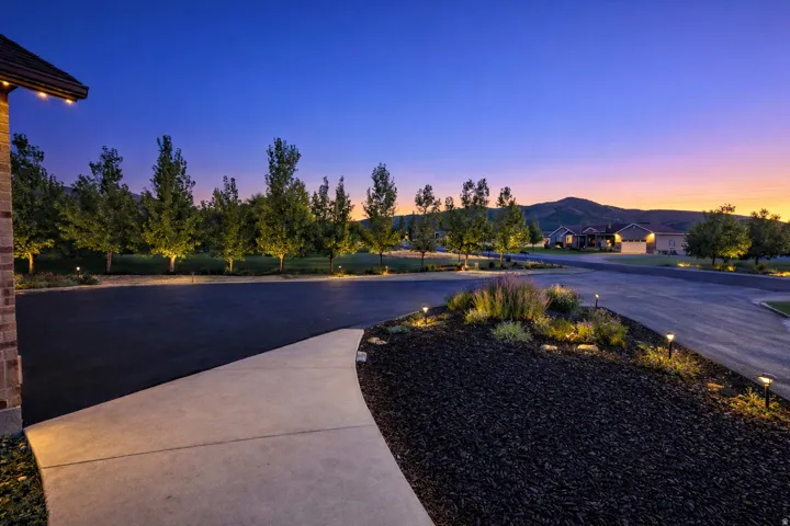 View of patio / terrace with a mountain view and driveway