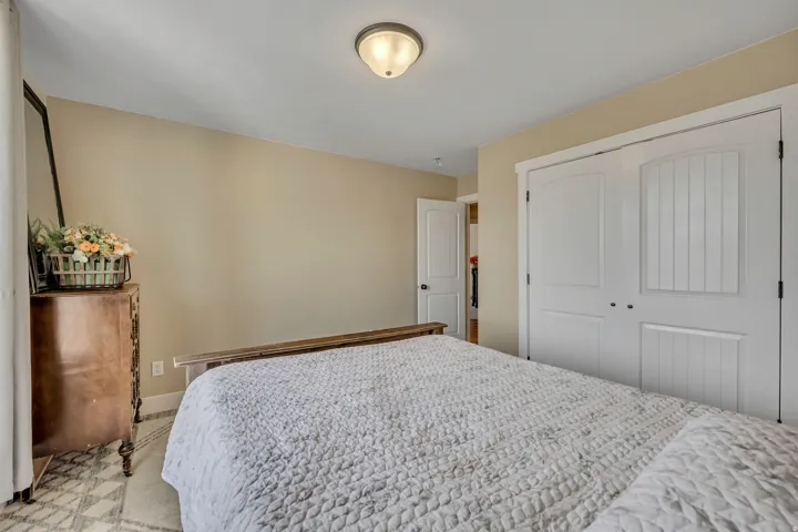 Bedroom with a closet and baseboards