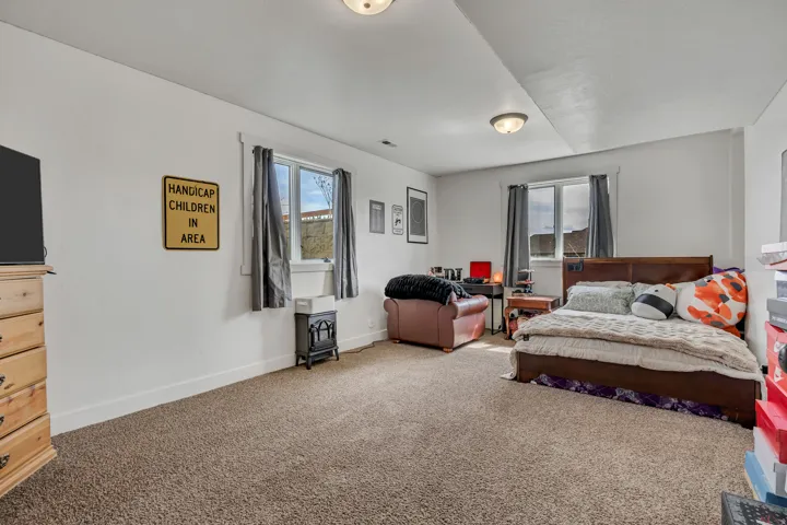 Carpeted bedroom with baseboards