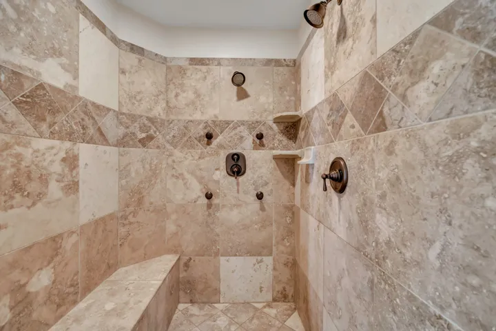 Bathroom view of a tile shower