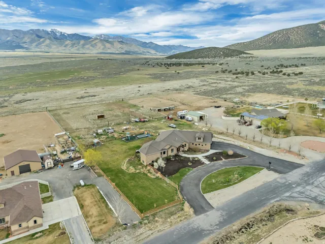Overview of rural landscape featuring a mountain backdrop and nearby suburban area