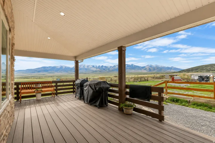 Covered outdoor deck with composite decking and recessed lighting