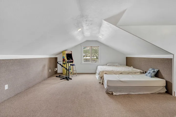 Bedroom with carpet flooring and baseboards