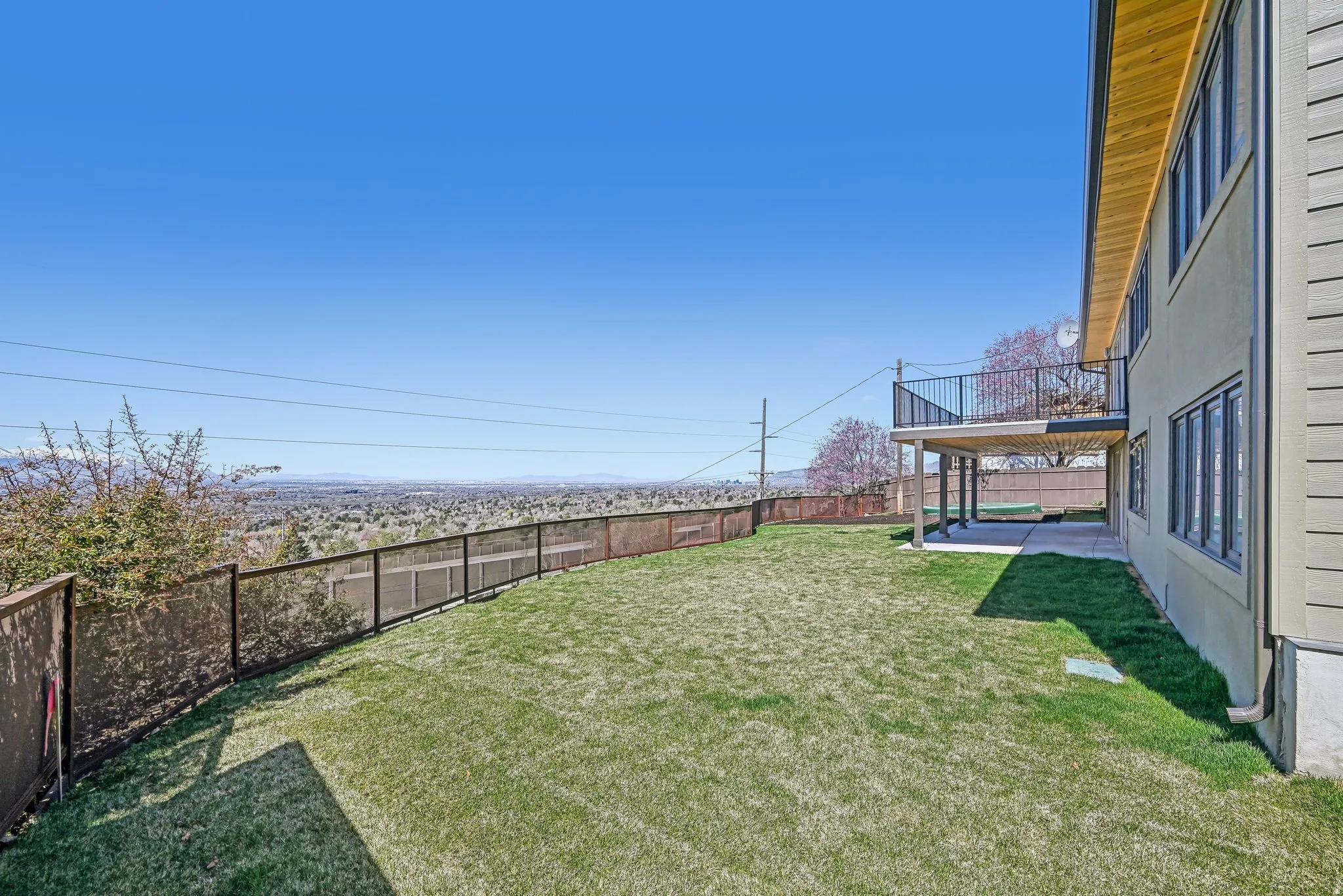 Fenced backyard with a patio