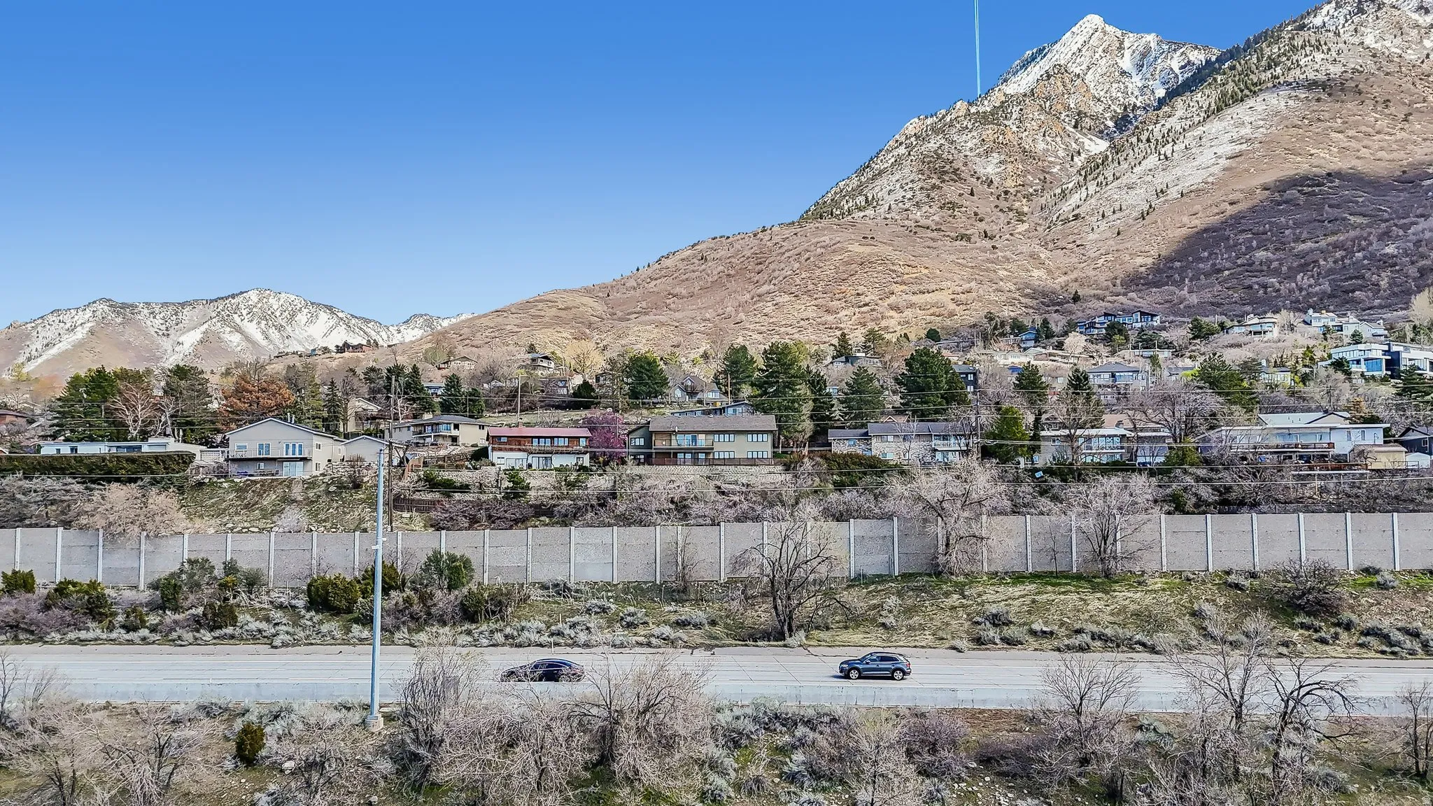 View of mountain backdrop with nearby suburban area