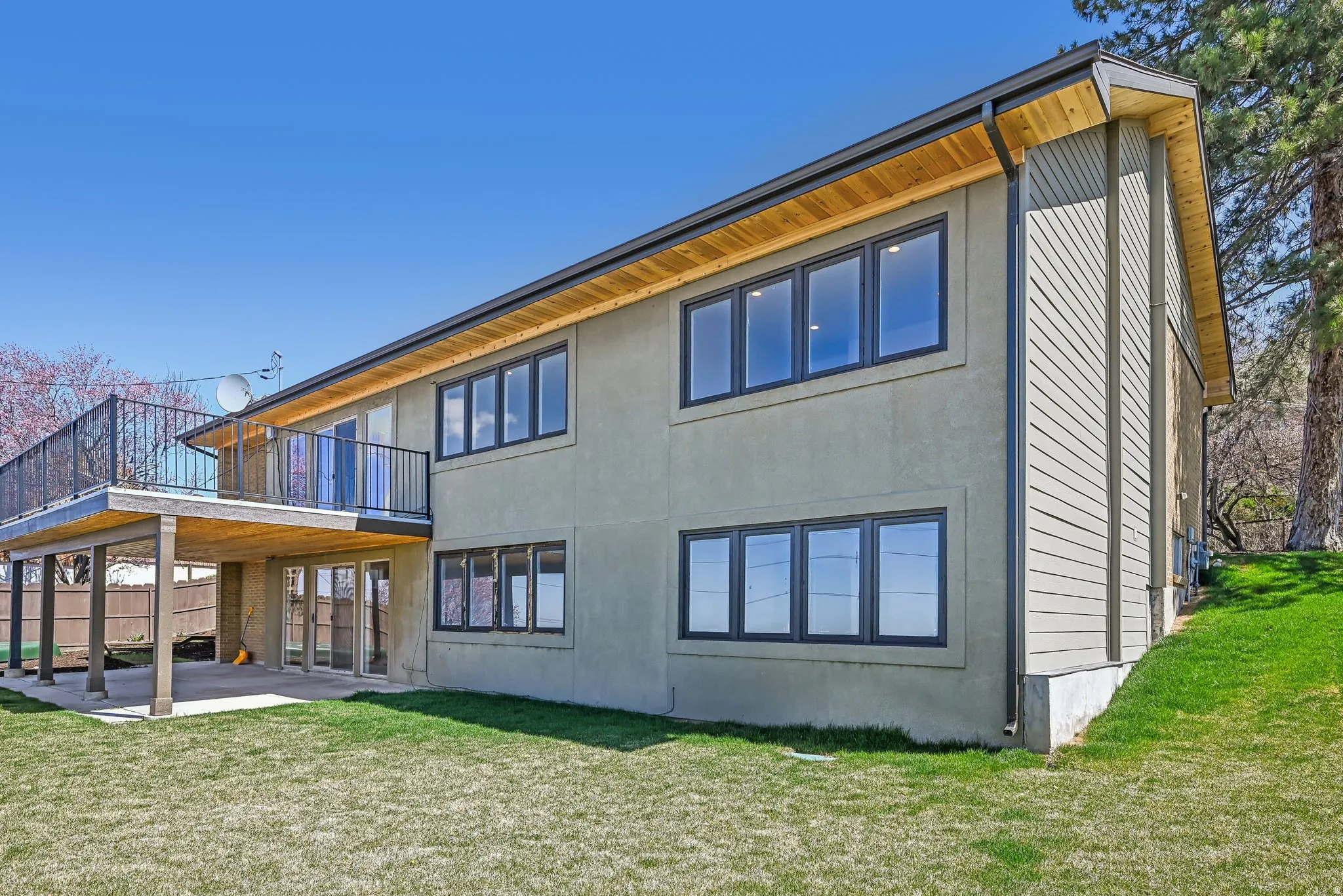 Rear view of house featuring a patio and stucco siding