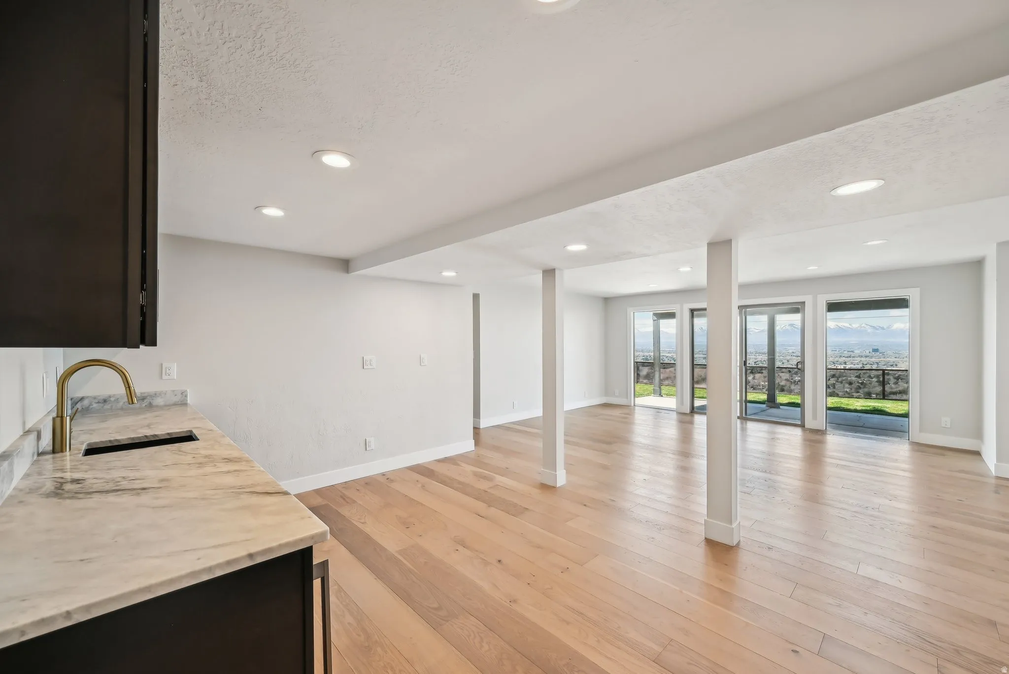 Wet bar and wall of windows.