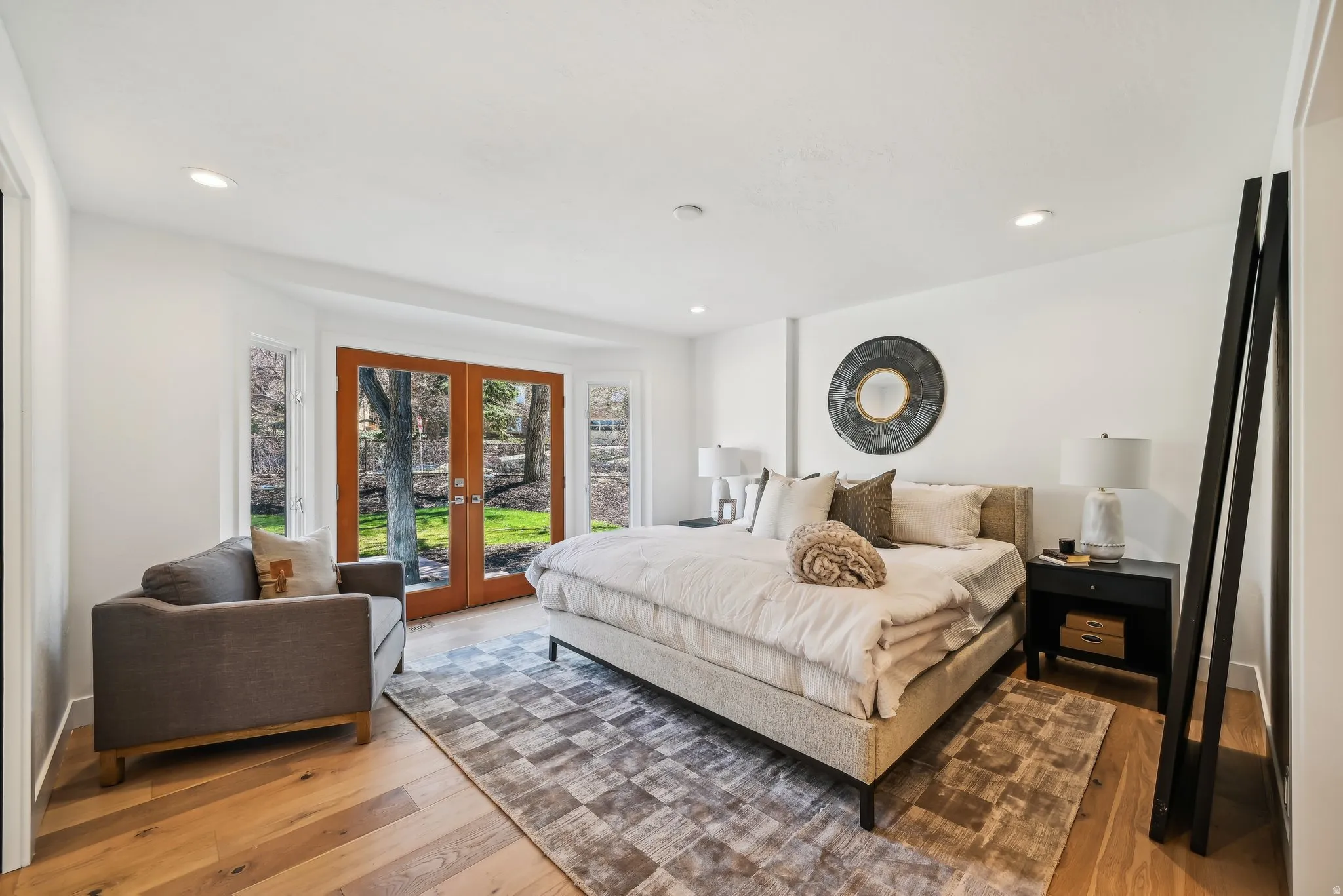 Primary bedroom with french doors to the front patio with Mt Olympus views.