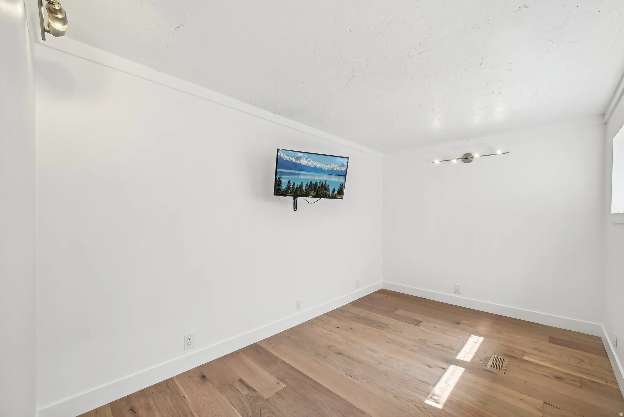 exercise room with natural light, white oak floors
