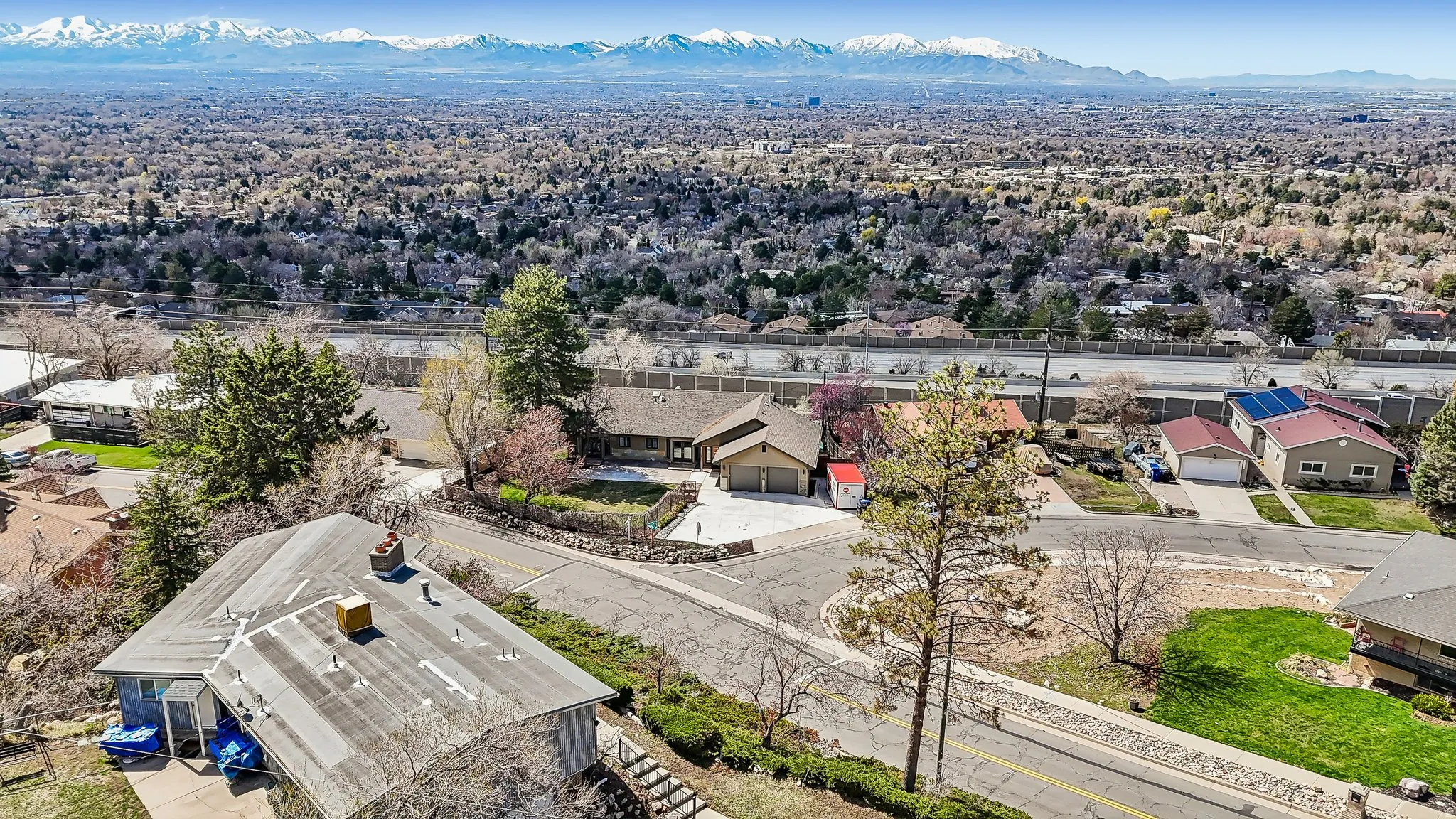 Aerial view of residential area with a mountainous background