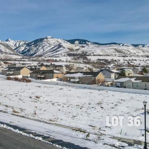 View of mountain backdrop with nearby suburban area
