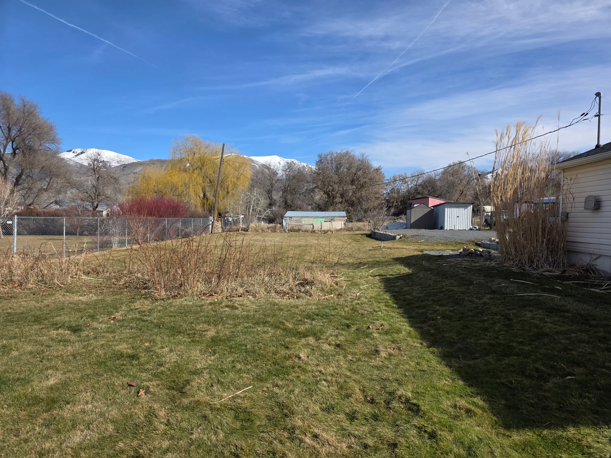 View of yard with a mountain view and an outdoor structure
