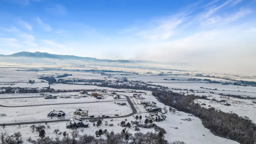 Snowy aerial view with a mountain view