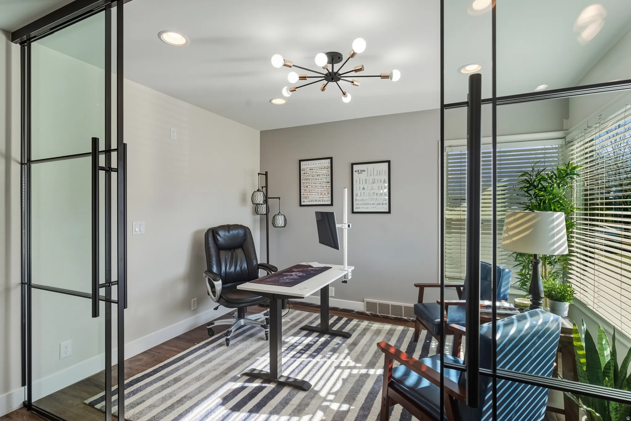 Office featuring a chandelier and wood finished floors