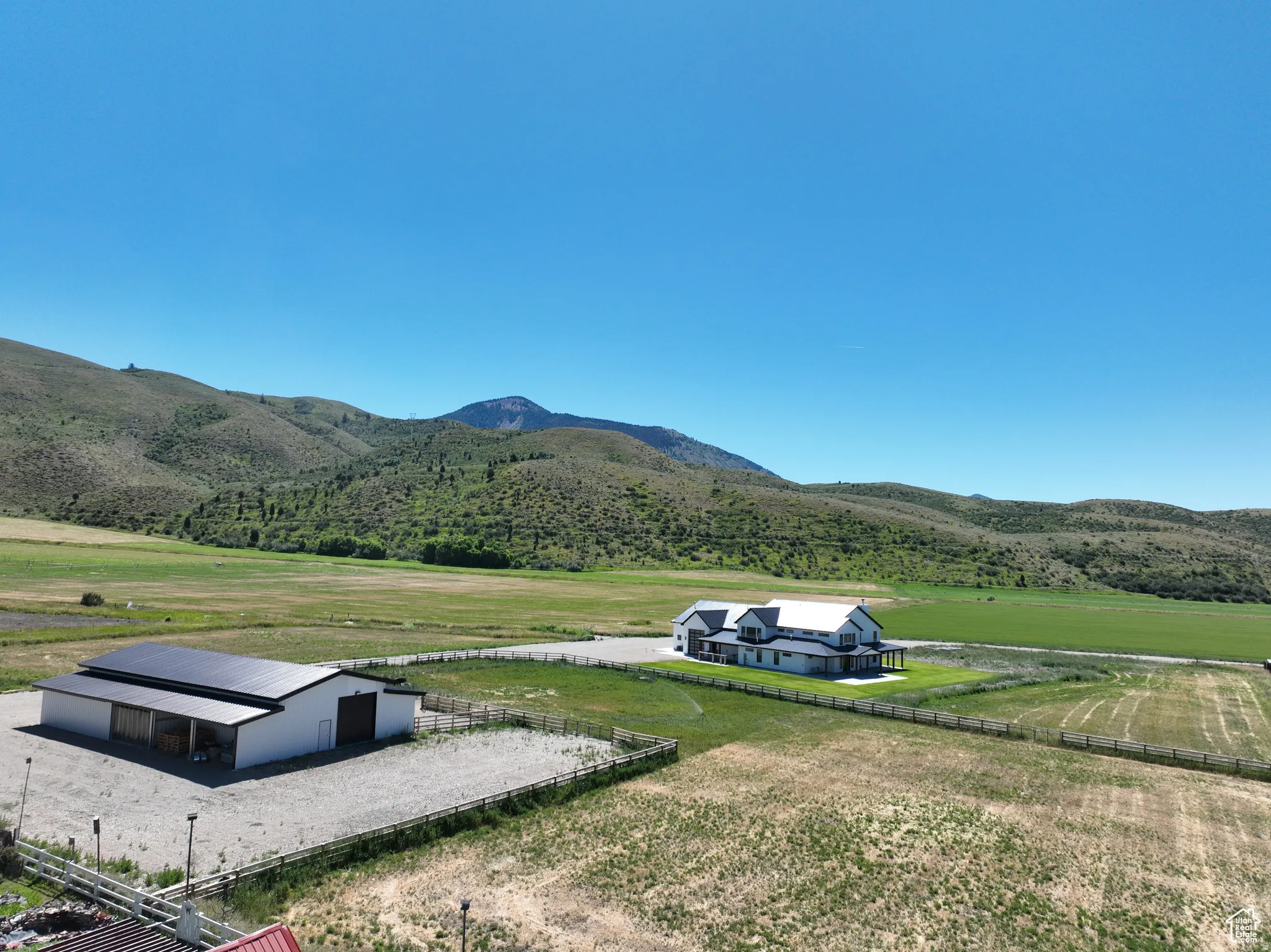 View of mountain backdrop featuring rural landscape