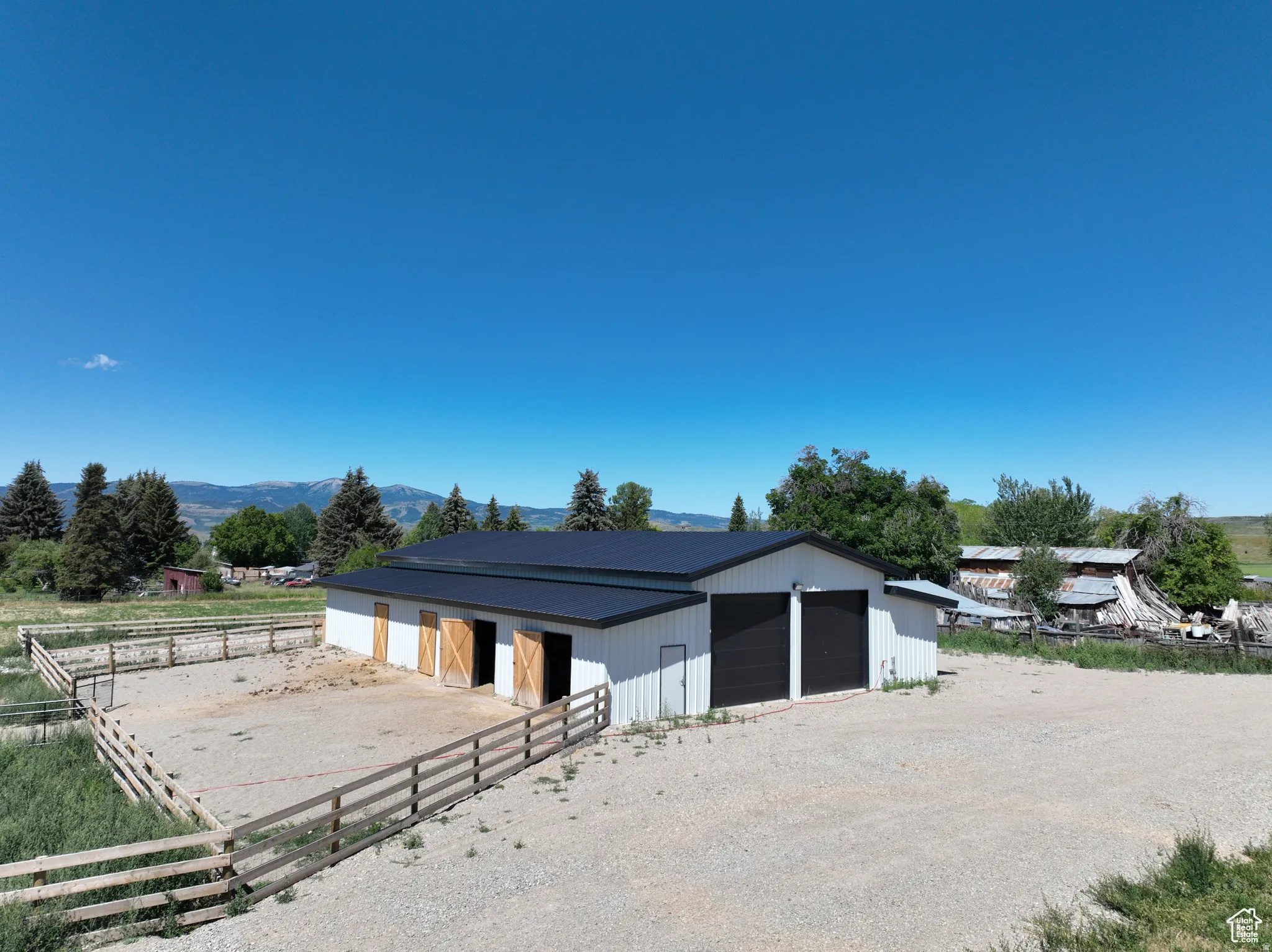 Horse barn featuring a view of rural / pastoral area