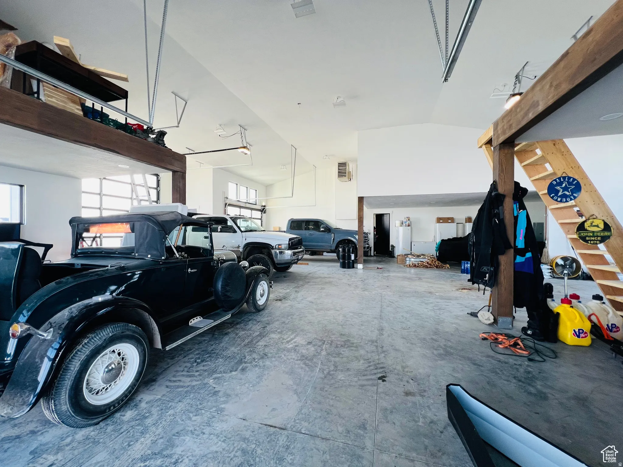 Garage with a heating unit and freestanding refrigerator