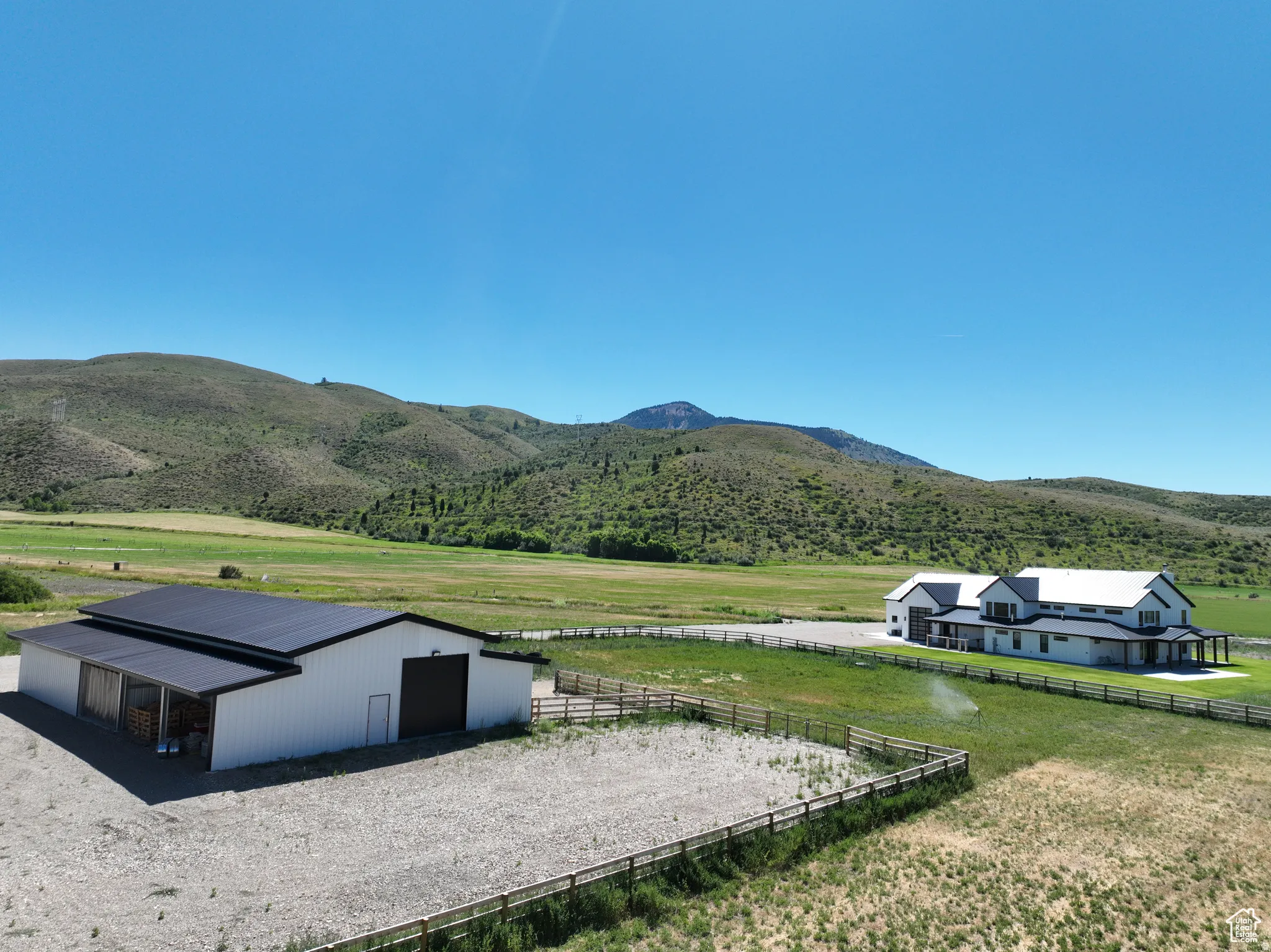 View of mountain backdrop featuring rural landscape