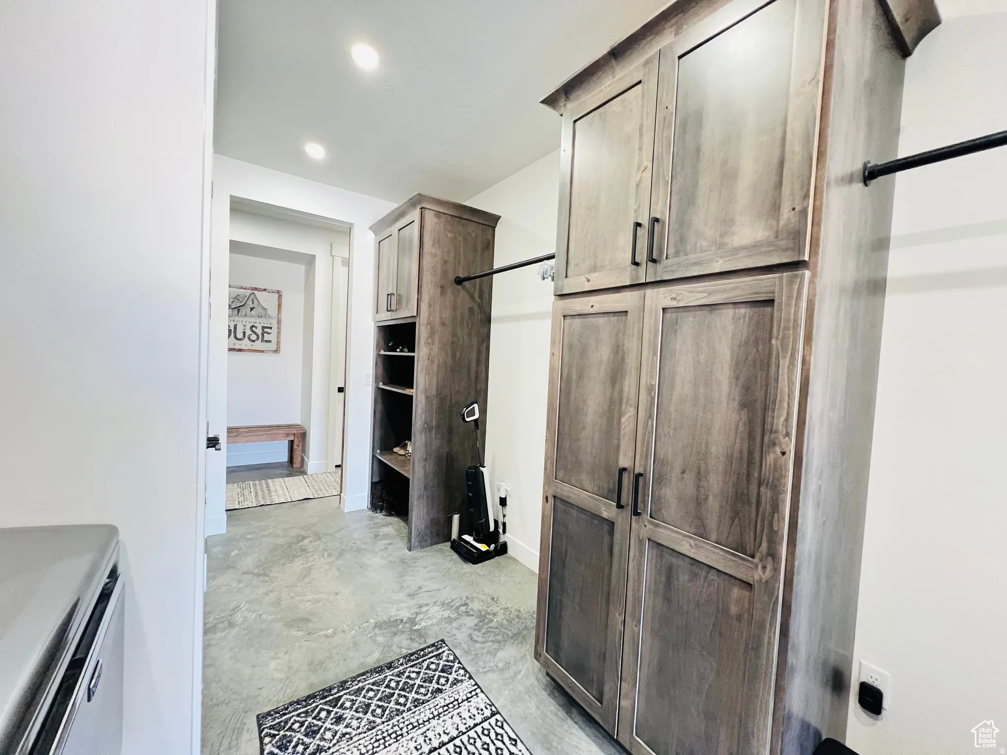 Bathroom with unfinished concrete floors and recessed lighting