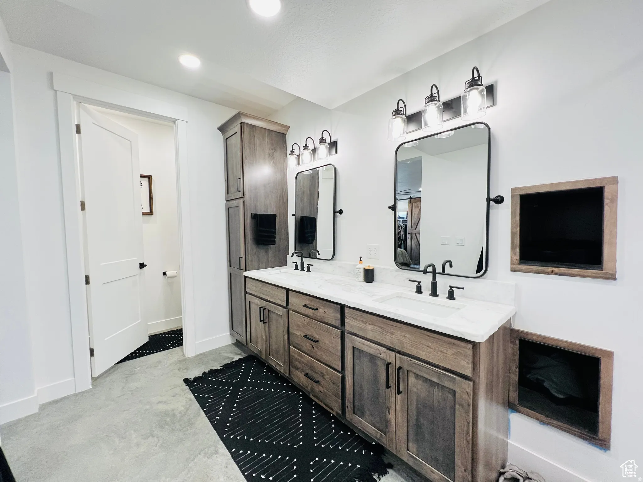 Full bathroom with double vanity, concrete flooring, and recessed lighting