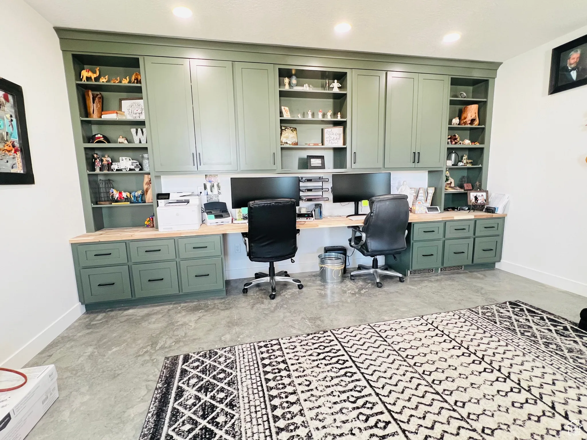 Home office featuring built in features and built in desk