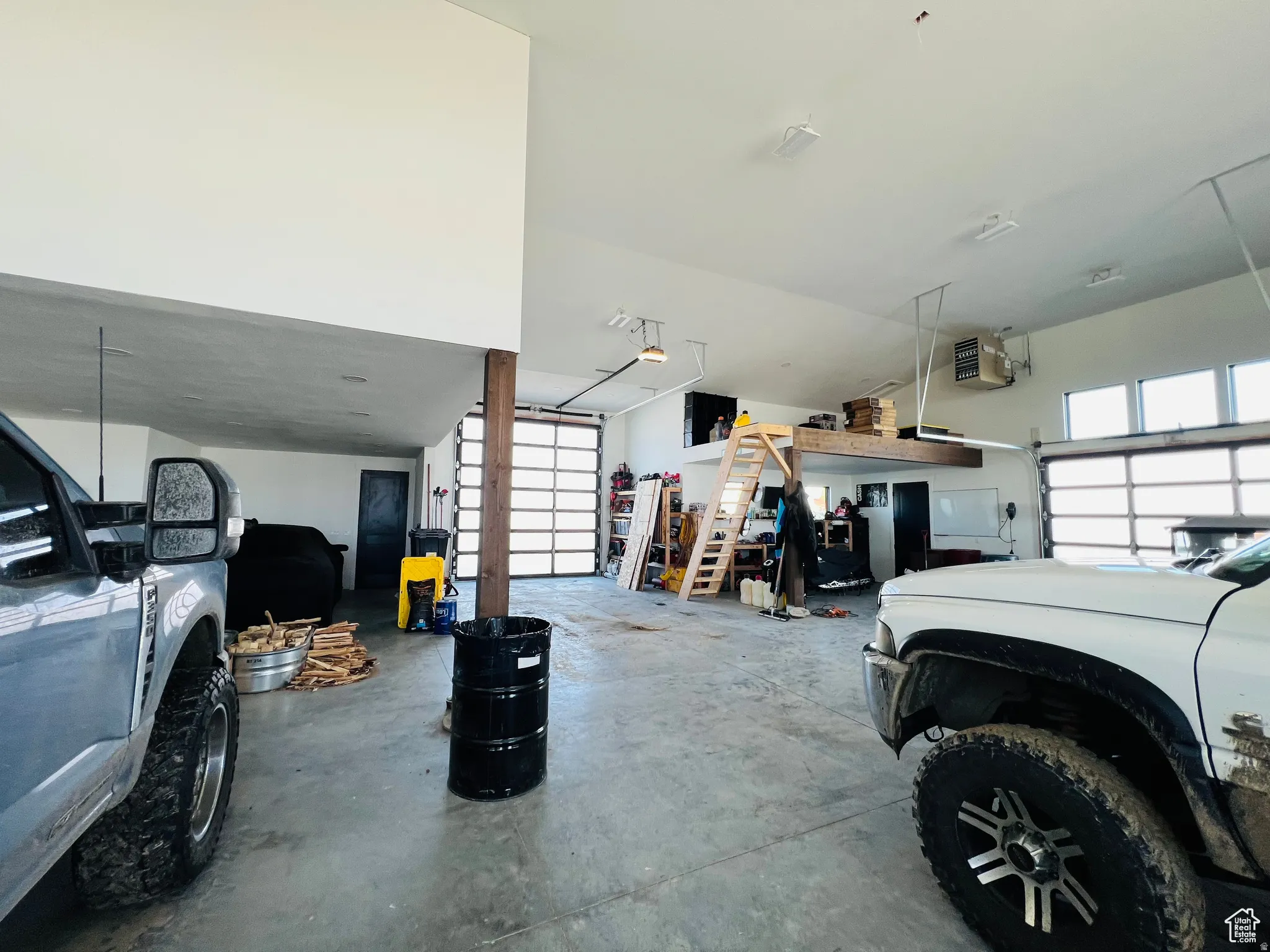 Garage featuring a heating unit