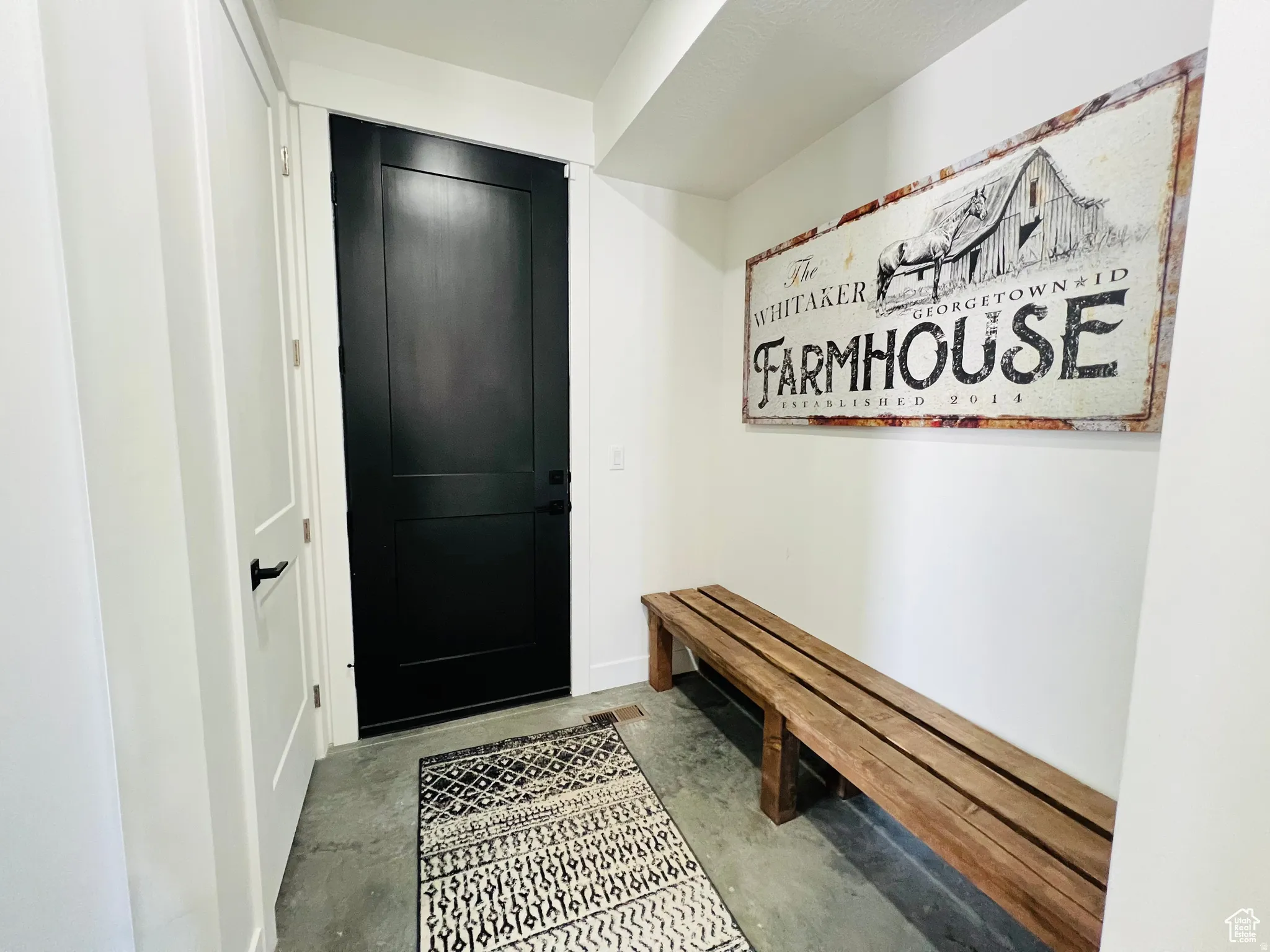 Mudroom with unfinished concrete floors