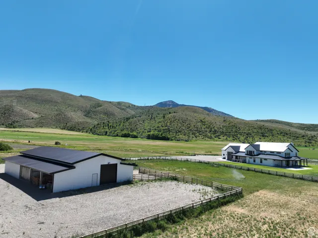 View of mountain backdrop featuring rural landscape