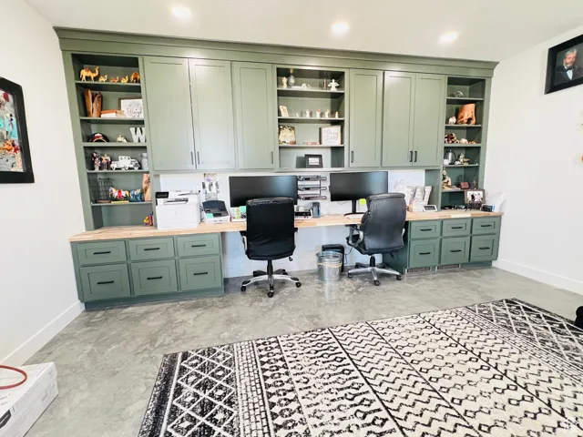 Home office featuring built in features and built in desk
