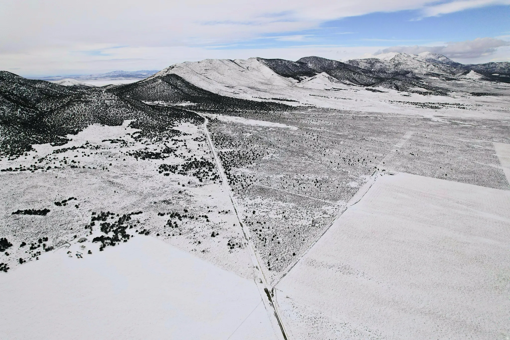 View of dirt road access near land