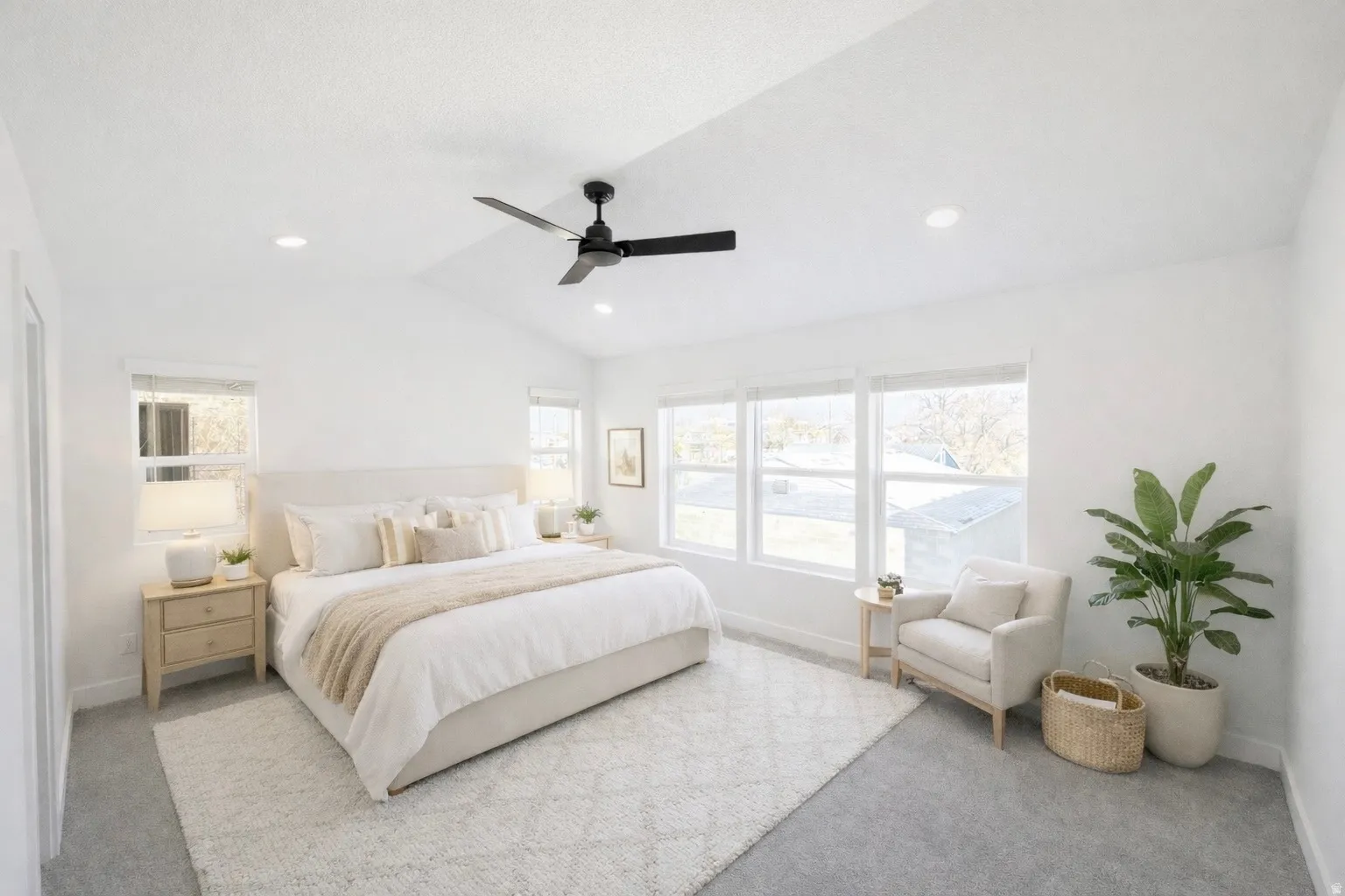 Bedroom with lofted ceiling, light carpet, a ceiling fan, multiple windows, and recessed lighting