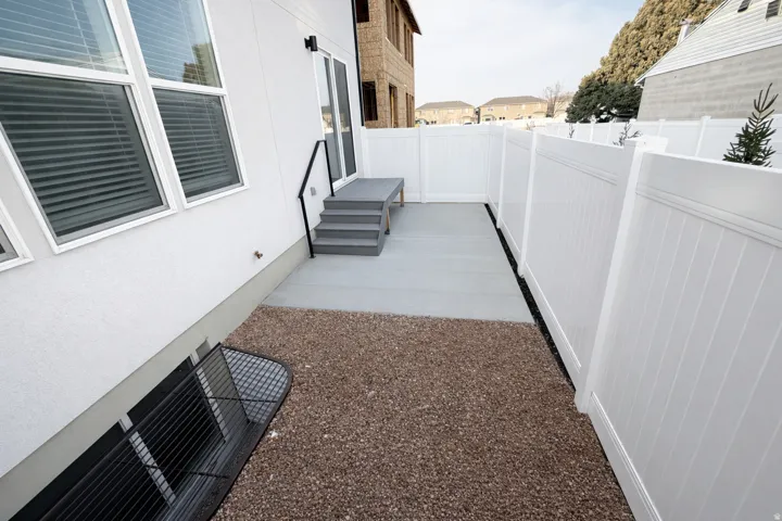 Fenced backyard with a patio area