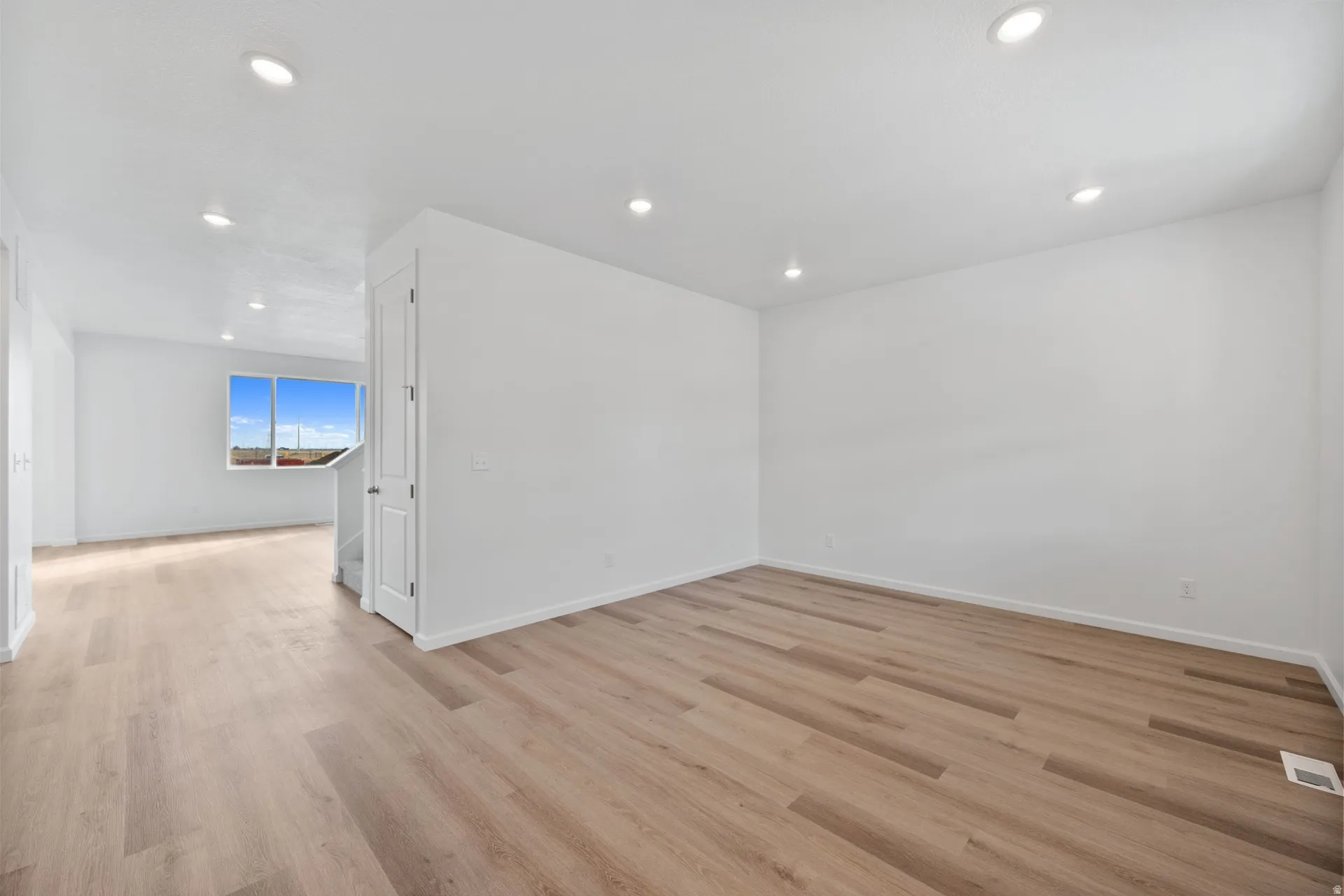 Entry bonus room featuring light wood-type flooring and recessed lighting