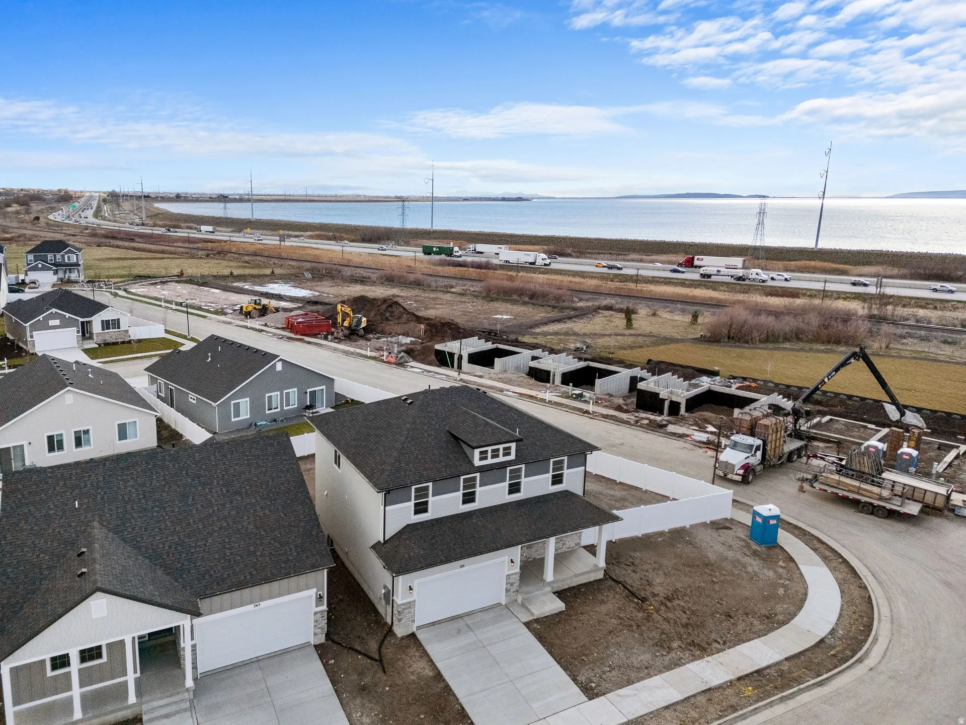 Aerial perspective of suburban area with views of Willard Bay