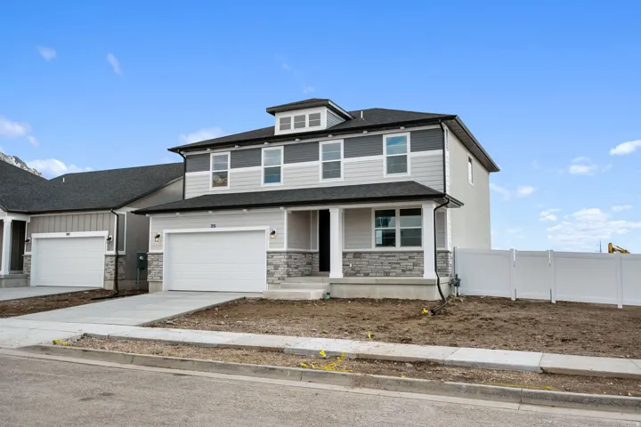 View of front of home with covered porch, stone siding, concrete driveway, an attached garage, and a shingled roof