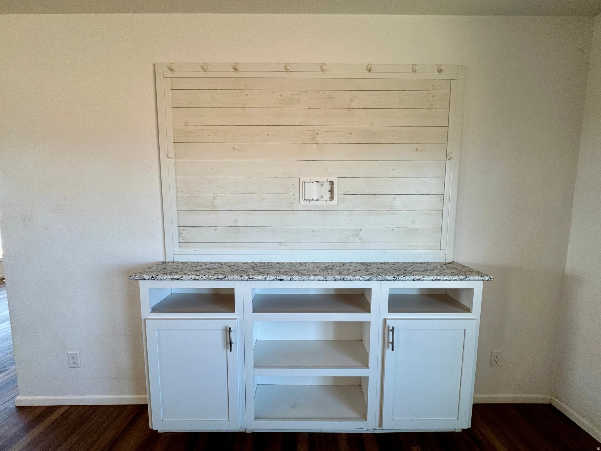 Detailed view of baseboards and wood finished floors