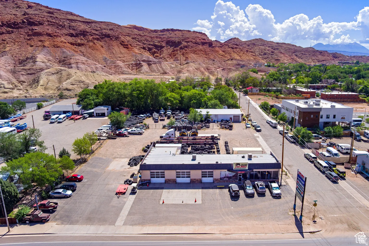 Aerial view of a mountainous background and a commercial area