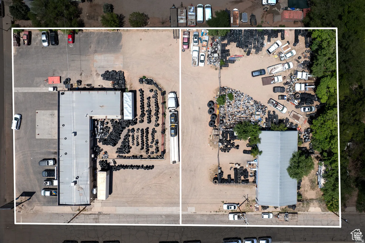 Aerial view of property's location with property boundaries highlighted and an industrial area