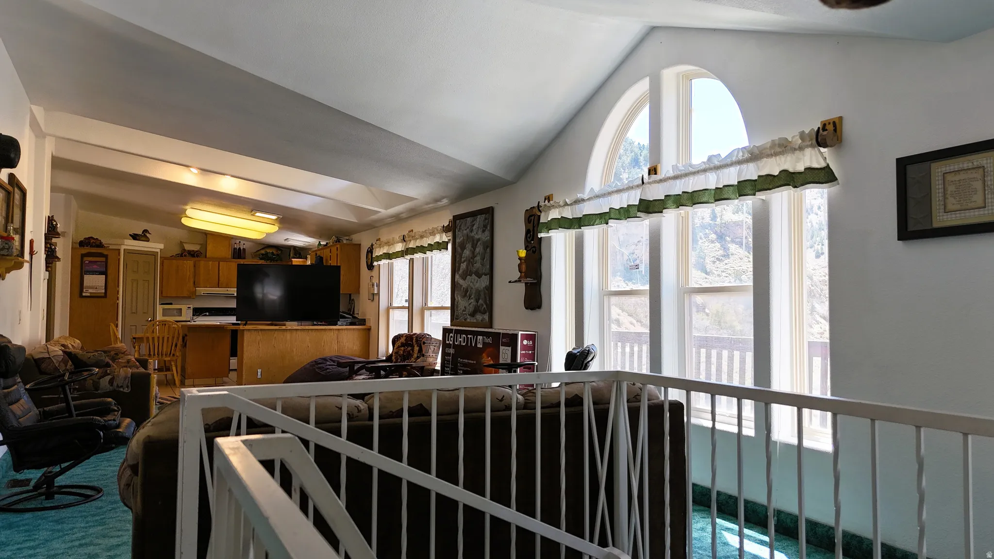 Living area with vaulted ceiling