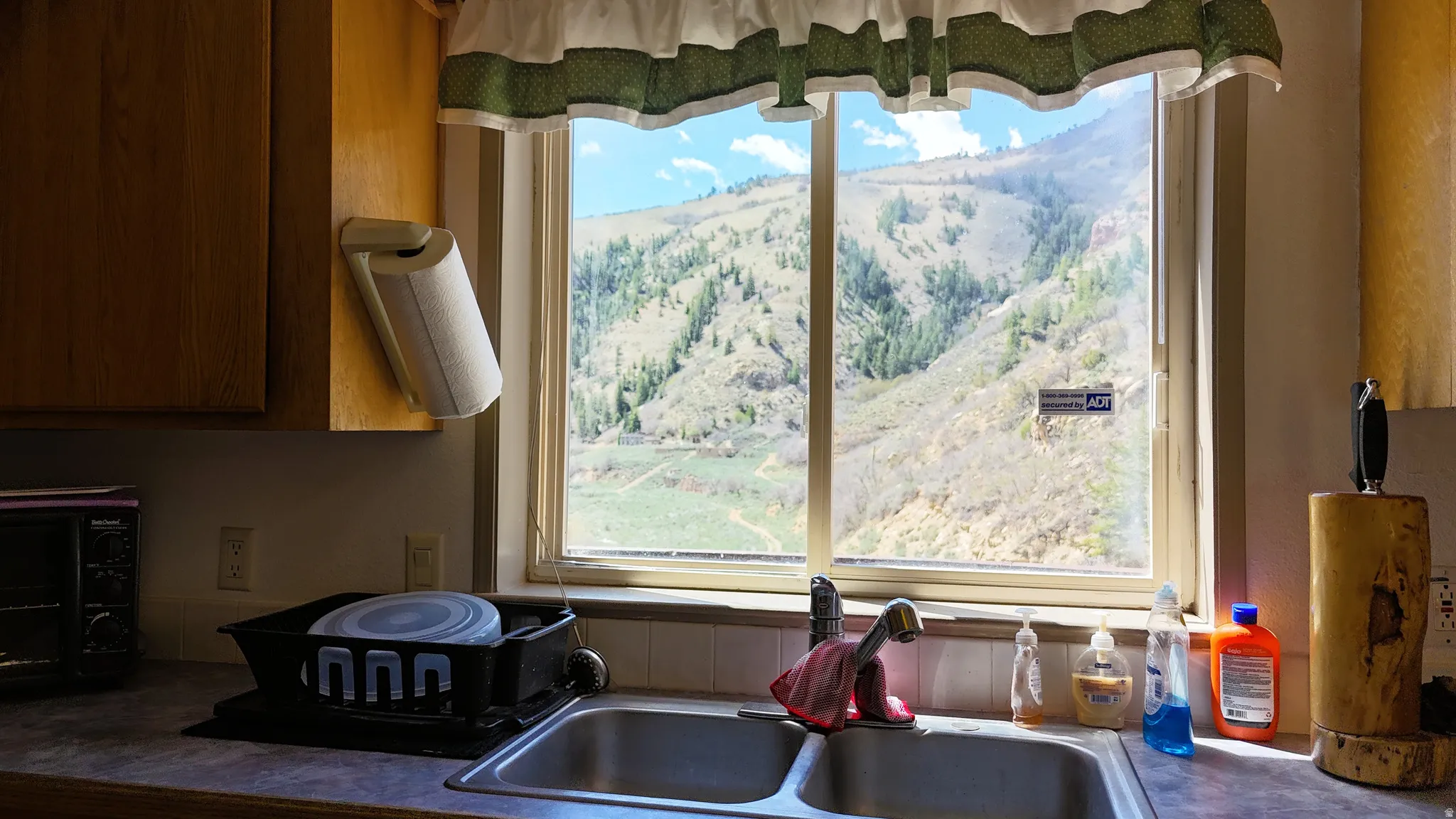 Kitchen view of wood finish cabinetry