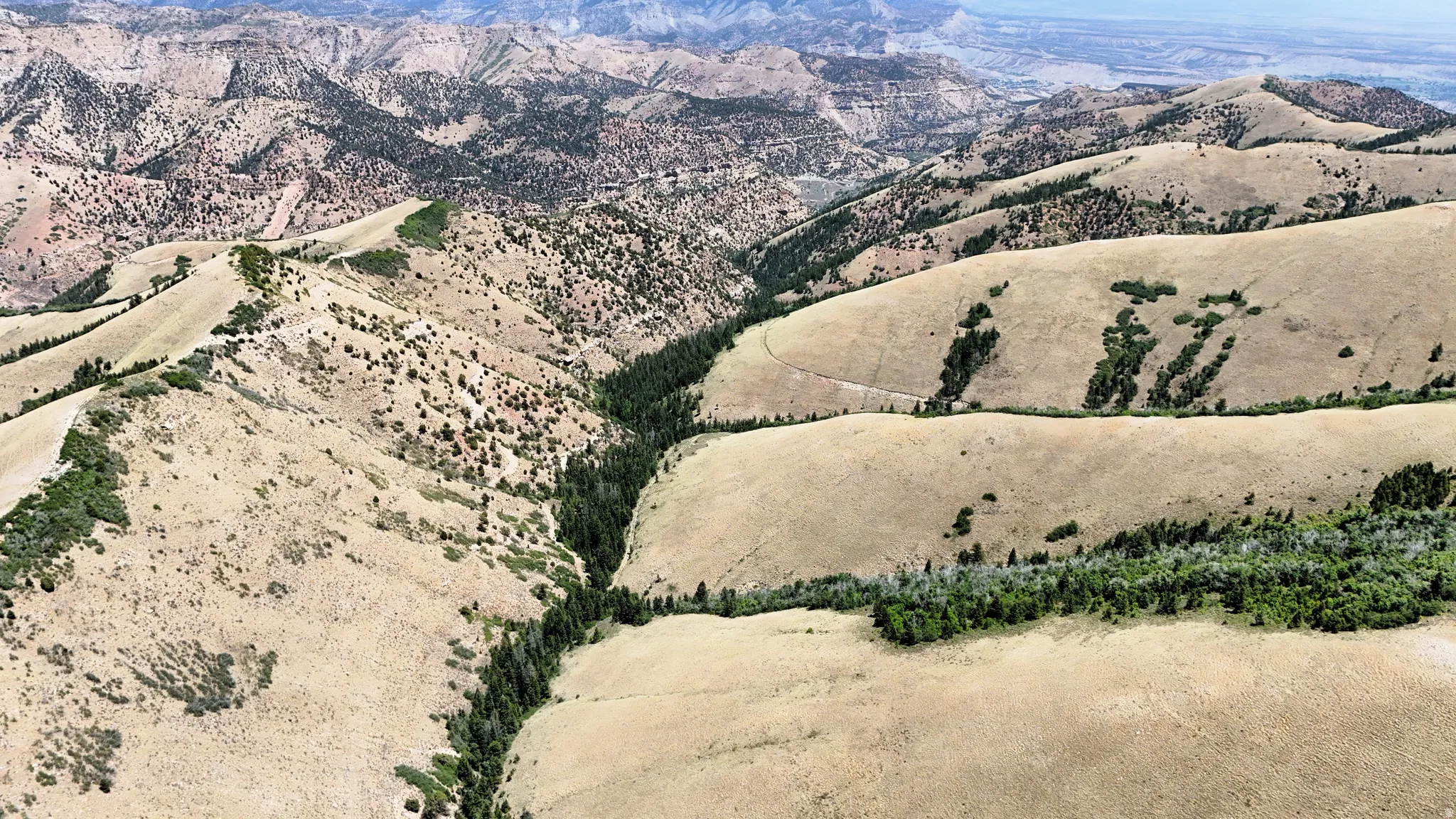 View of mountain backdrop with rural landscape